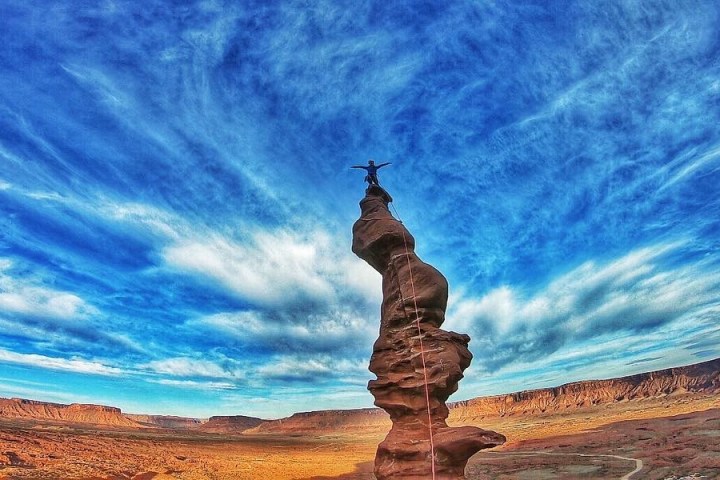 a person standing in front of a canyon